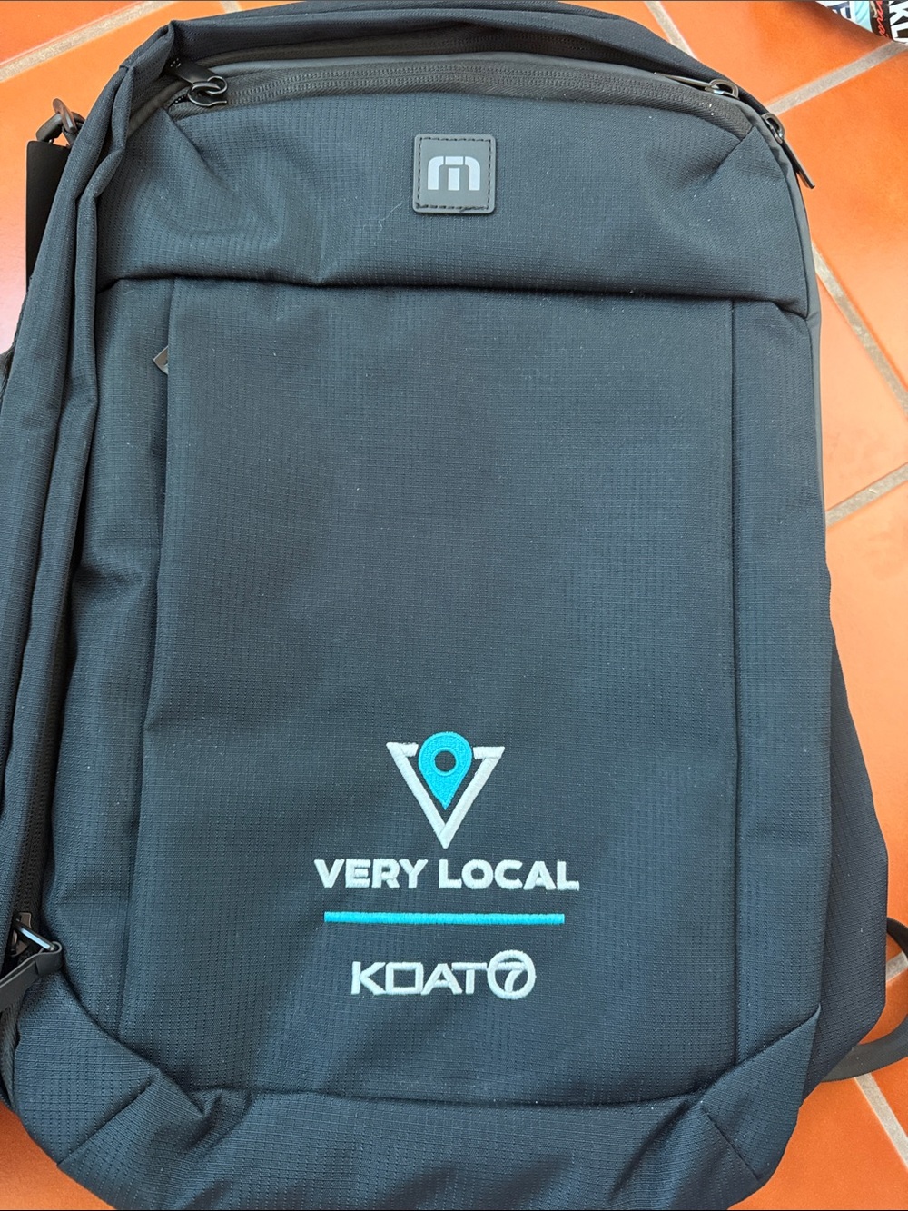 Travis Mathew Black Backpack with Teal Logo Accent
